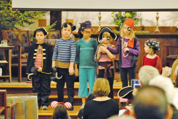 kids in holiday pageant dressed as pirates